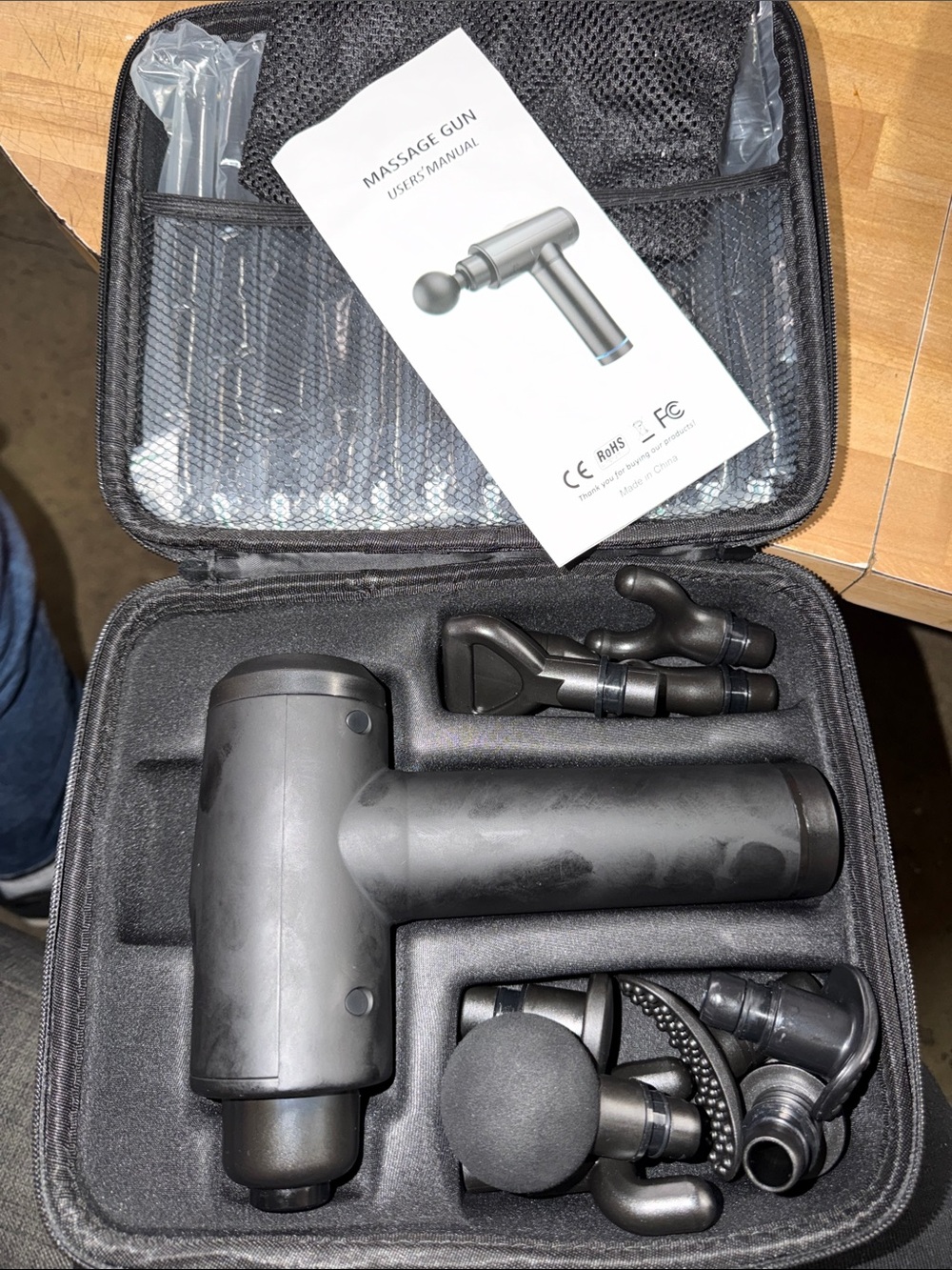 Portable Black Massage Gun with Multiple Attachments